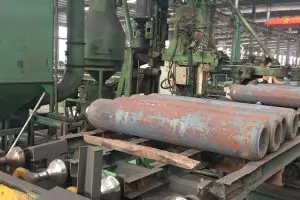 The bottom of the cylinder is reshaped to create a flat, sealed surface.
